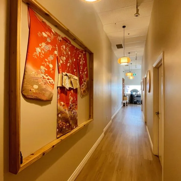 Japanese kimono wall decor in Cozy Foot Spa hallway